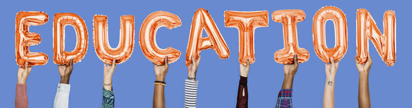 Hands showing education balloons word