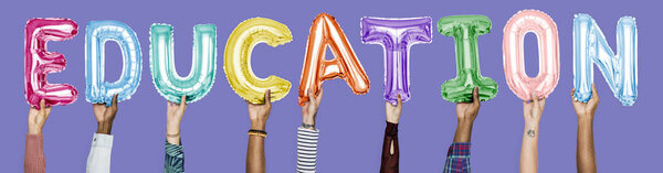 Hands showing education balloons word