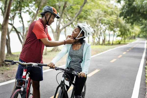 Man Fastening Bike Helmet His Girlfriend — Stock Photo, Image