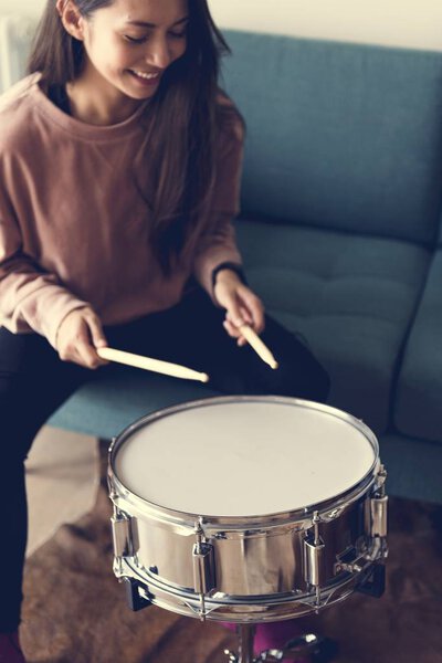 White Woman Playing Drum Royalty Free Stock Images
