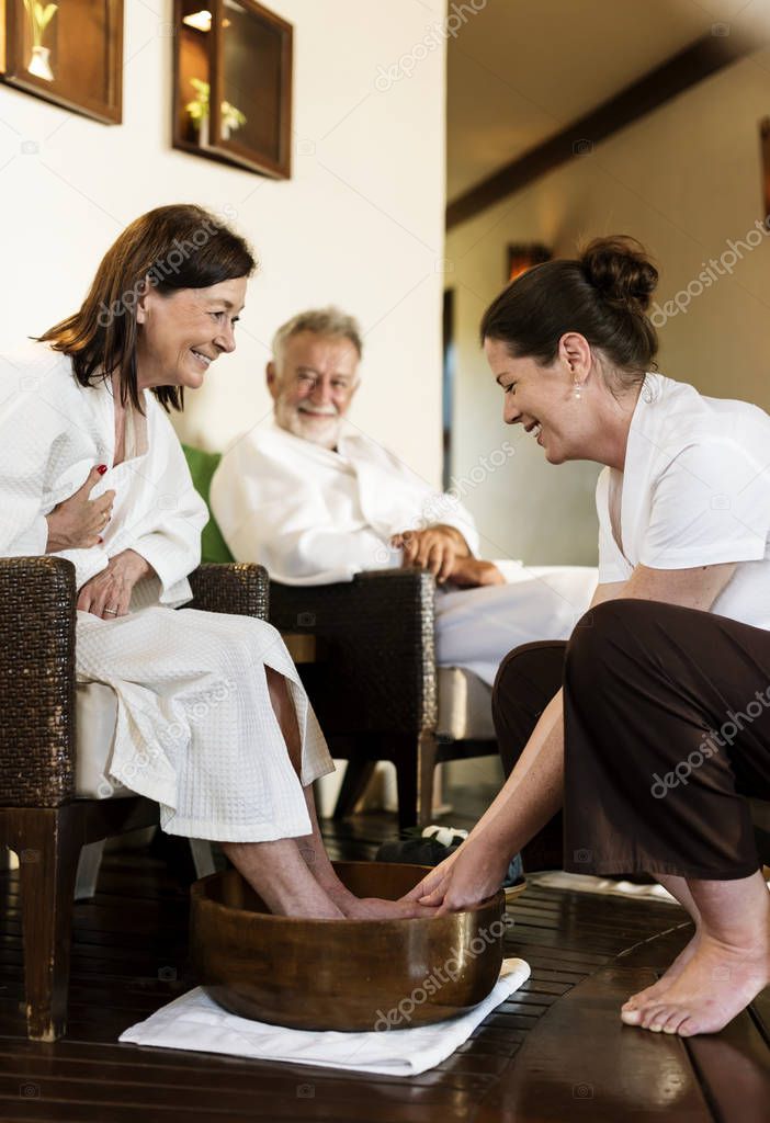 Senior couple relaxing with a spa treatment