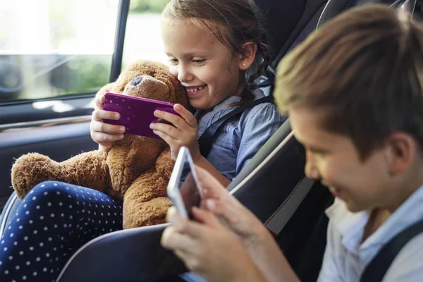 Sister Brother Playing Digital Devices Car — Stock Photo, Image