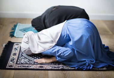 Muslim prayers in Sujud posture clipart