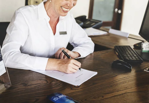 Receptionist working at the front desk