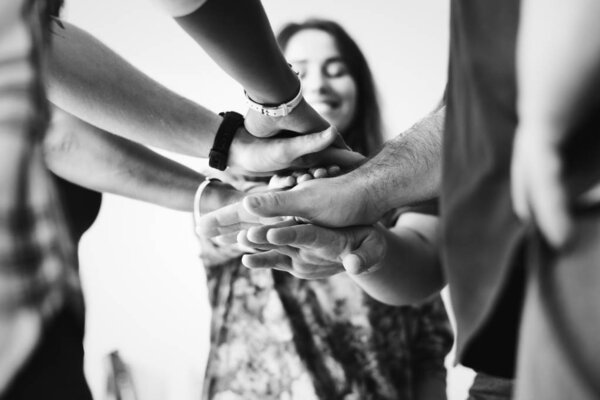 Group of diverse people joined hands