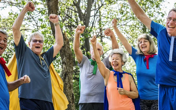 Childlike Seniors Wearing Superhero Costumes — Stock Photo, Image