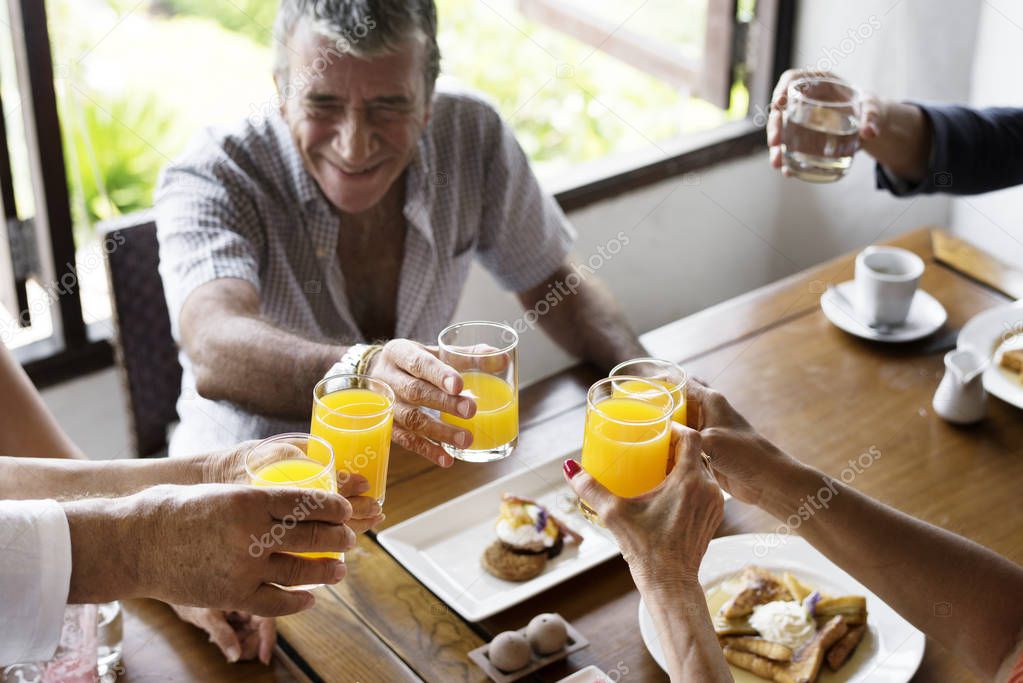 Senior people enjoying breakfast