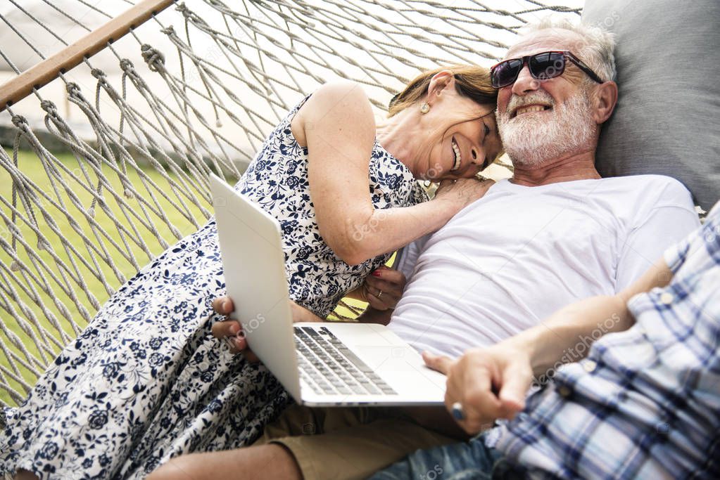 Senior couple relaxing in a hammock