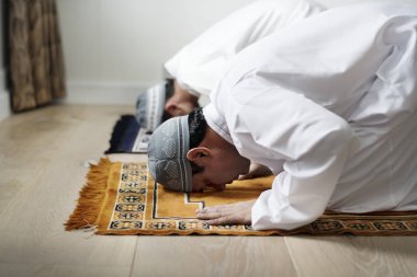 Muslim prayers in Sujud posture clipart