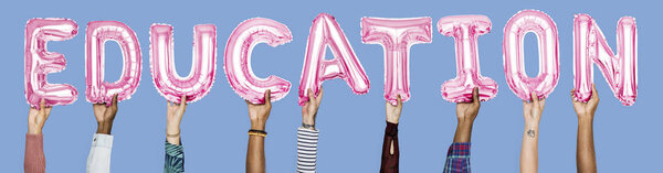 Hands showing education balloons word