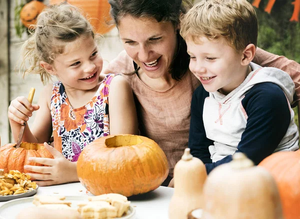 Young Kids Carving Halloween Jack Lanterns — стоковое фото