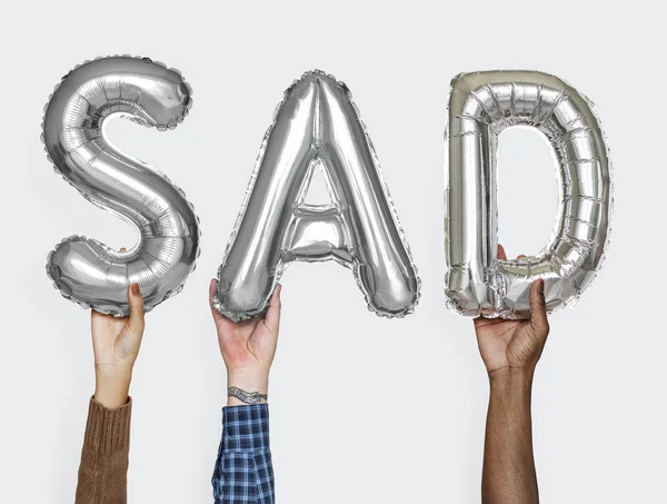 Manos Mostrando Palabra Triste Globos — Foto de Stock