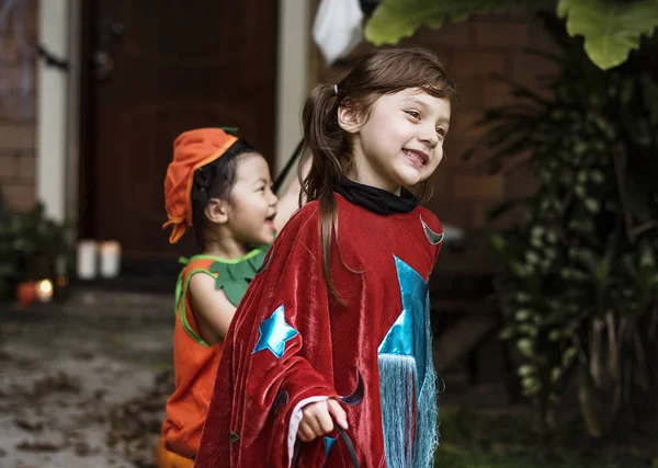 Young kids trick or treating during Halloween — Stock Image Young Kids Trick Treating Halloween Stock Image