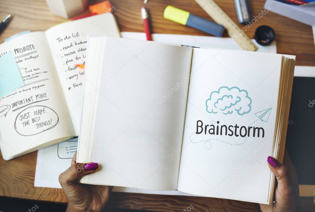 Brainstorm ideas on a notebook