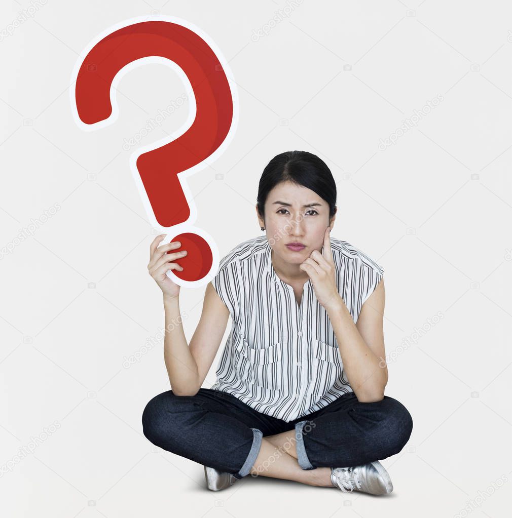 Confused woman holding a question mark icon