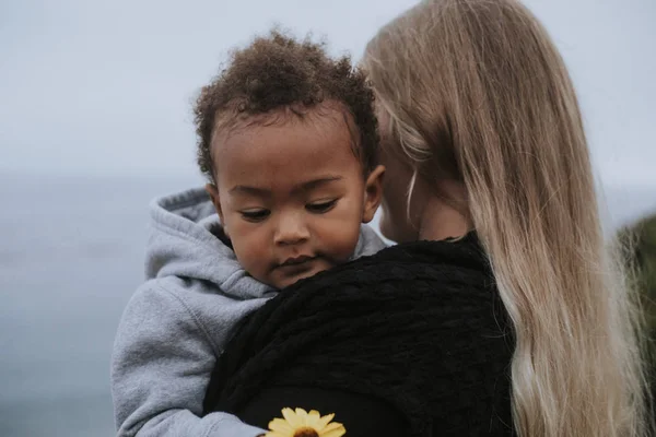 Young Boy Holding Flower Carried His Mom — Stock Photo, Image