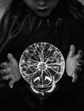 Little fortune teller with a plasma ball clipart