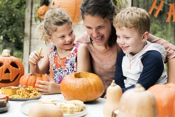 Young Kids Carving Halloween Jack Lanterns — стоковое фото