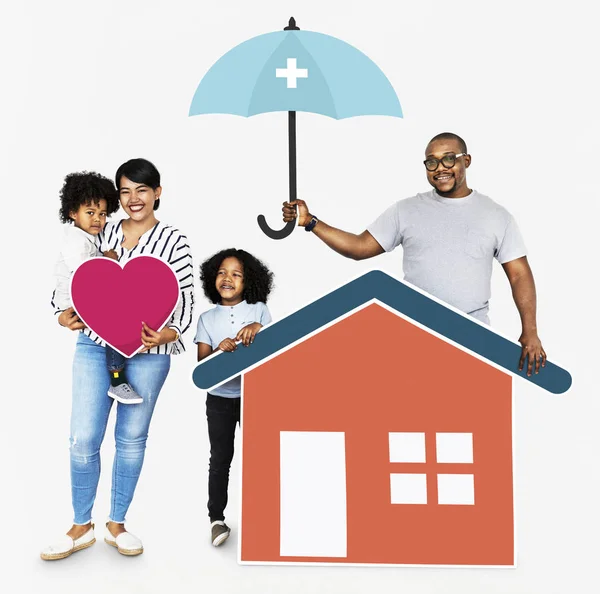 Happy family with house insurance