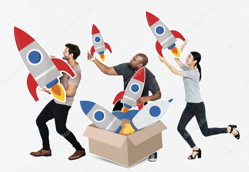 Group of diverse people with rockets in box