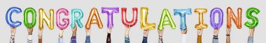 hands holding shiny colorful balloons letters congratulations clipart