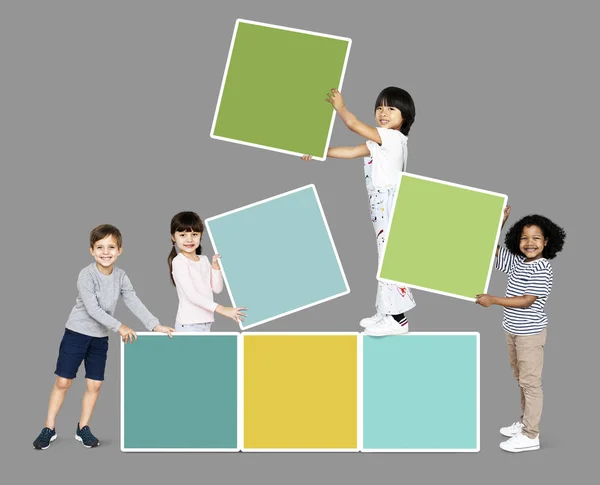 Diverse Happy Kids Stacking Empty Square Boards — Stock Photo, Image