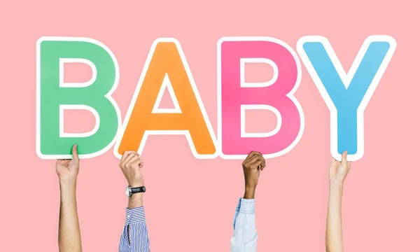 Mãos Segurando Bebê Palavra — Fotografia de Stock