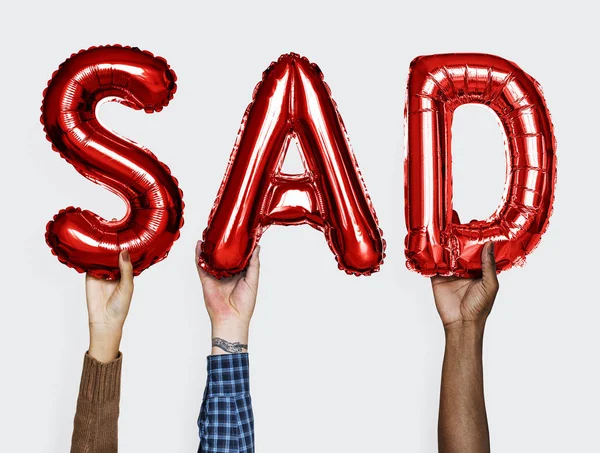 Manos Mostrando Palabra Triste Globos — Foto de Stock