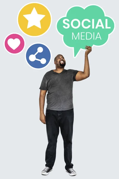 Man Holding Social Media Symbols — Stock Photo, Image