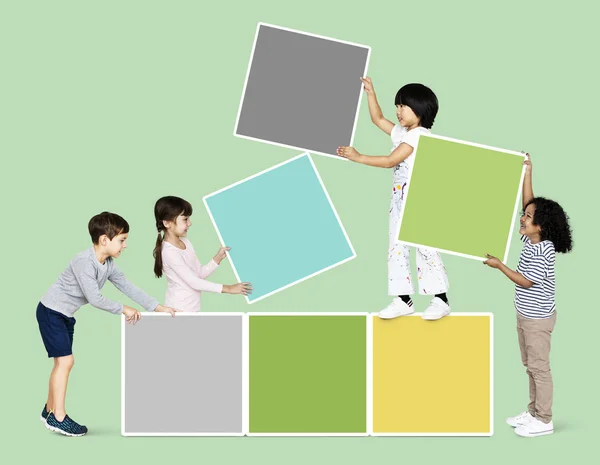 Diverse Happy Kids Stacking Empty Square Boards — Stock Photo, Image