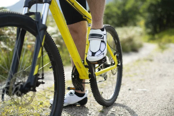 Closeup of a man wearing cycling shoes