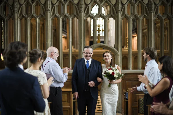 Father of the bride walking his daughter down the aisle