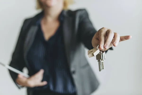 Real estate agent handing over the keys