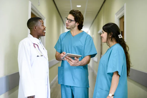 Medical team having a conversation in the hallway