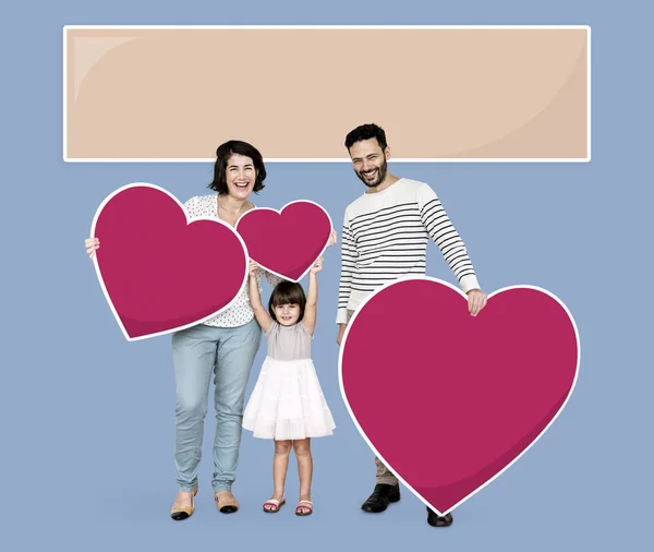 Familia Feliz Sosteniendo Iconos Del Corazón —  Fotos de Stock
