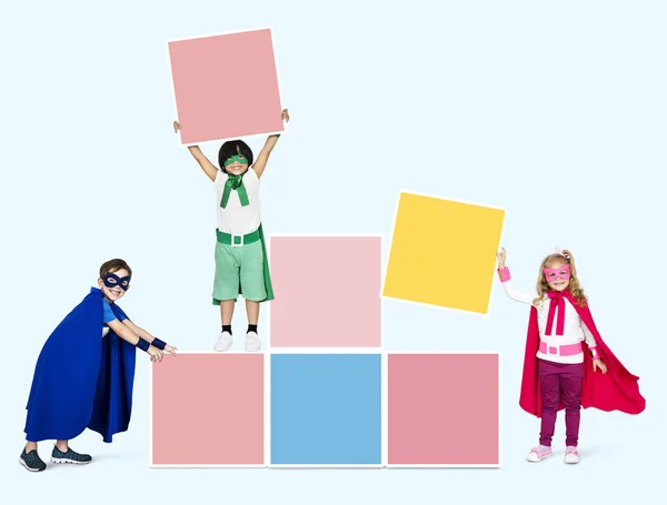 Young Superheroes Stacking Empty Boxes — Stock Photo, Image
