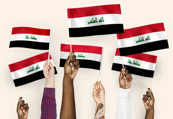 Manos Ondeando Banderas Irak —  Fotos de Stock