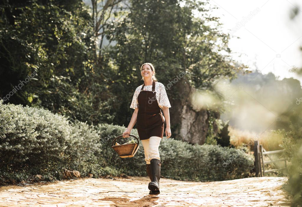 Happy woman walking at her farm