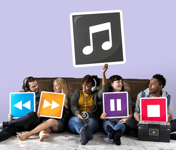 People Holding Media Player Icons Musical Note — Stock Photo, Image