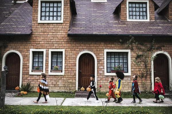 Young Kids Trick Treating Halloween Stock Photo