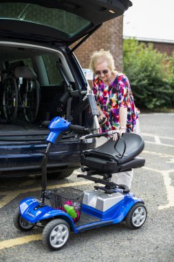 Senior woman on an electric wheelchair clipart