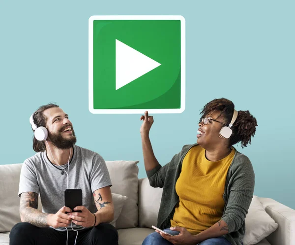 Interracial Couple Listening Music Holding Play Button — Stock Photo, Image