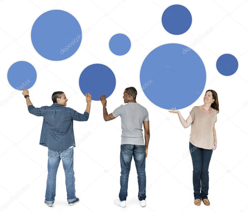 Diverse people holding blue round icons