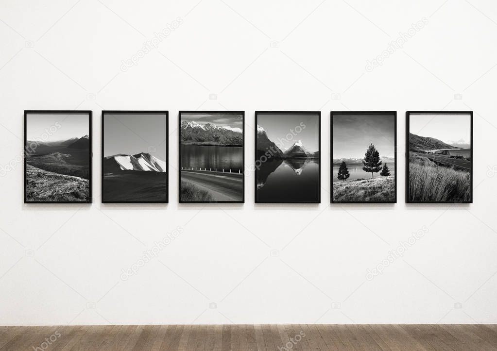 Collection of scenic art pieces on a wall