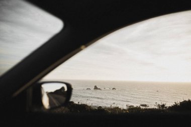 Car passing the Big Sur coast in California, USA clipart
