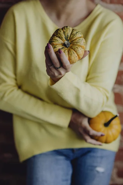 Woman Yellow Sweater Holding Pumpkins Her Hands — Stock Photo, Image