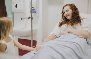 Young girl visiting her mother in the hospital clipart