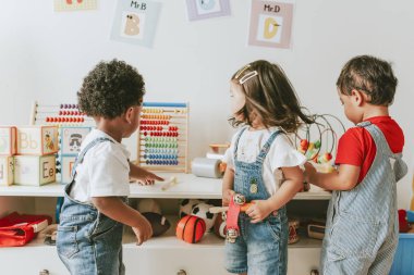 Young children playing with educational toys