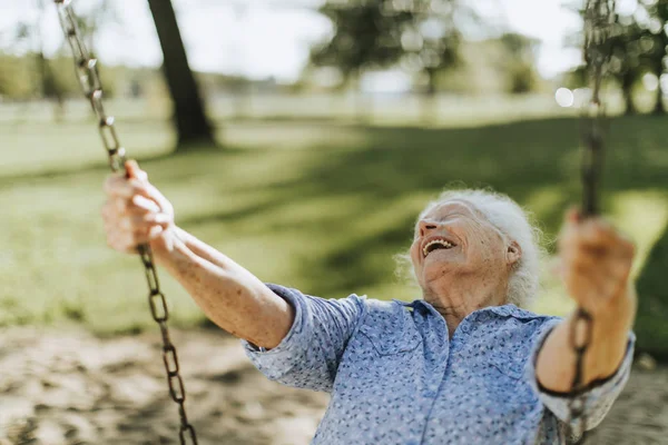 Cheerful Senior Woman Swing Playground — Stock Photo, Image