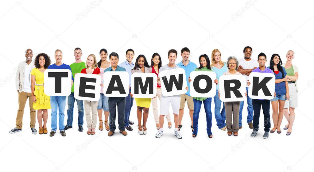 Multi-Ethnic Group Of Diverse People Holding Letters That Form Teamwork